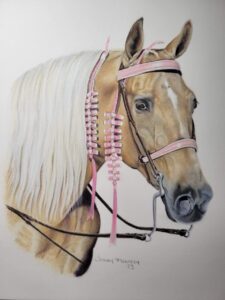 Realistic colored pencil portrait of a palomino Missouri Foxtrotter mare wearing a pink bridle and ribbons, capturing intricate details and lifelike features.
